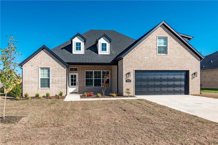 Stunning brand new home right in the heart of NWA!! Only minutes to Fayetteville, Rogers, Bentonville, I-49, HWY 112, parks, trails, shopping, dining, and all the other great amenities of NWA! This incredible 4 bedroom home features an open/split layout, huge bonus/media room, beautiful hardwood floors, large kitchen island, quartz countertops, custom built cabinets that reach to the ceiling, gas range, under cabinet lighting, spacious vaulted primary bedroom, tiled shower, jacuzzi tub, massive walk in closet, covered front and back porch, fully fenced in yard, gas fireplace, and so much more!  fence, gutters, and blinds included! 1 year Warranty!