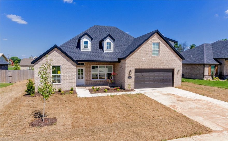 Stunning brand new home right in the heart of NWA!! Only minutes to Fayetteville, Rogers, Bentonville, I-49, HWY 112, parks, trails, shopping, dining, and all the other great amenities of NWA! This incredible 4 bedroom home features an open/split layout, huge bonus/media room, beautiful hardwood floors, large kitchen island, quartz countertops, custom built cabinets that reach to the ceiling, gas range, under cabinet lighting, spacious vaulted primary bedroom, tiled shower, jacuzzi tub, massive walk in closet, covered front and back porch, fully fenced in yard, gas fireplace, and so much more!  fence, gutters, and blinds included!