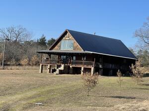 Cabin, pond and a little bit of acreage! 3 bedroom , 2 bath cabin sitting on 4.21 acres.