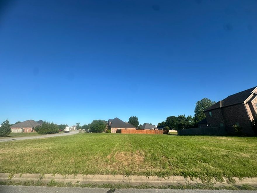 Build your dream home on this prime .36-acre corner lot in the heart of Bentonville! Ideally located next to the new Walmart Headquarters with quick and easy access to I-49, this property offers unbeatable convenience to everything Northwest Arkansas has to offer. Situated in an established neighborhood, this spacious lot combines location, accessibility, and opportunity all in one. Just minutes from shopping, dining, biking trails, entertainment, and downtown Bentonville, this is the perfect place to build. Don’t miss your chance to own a highly desirable corner lot in an exceptional location!