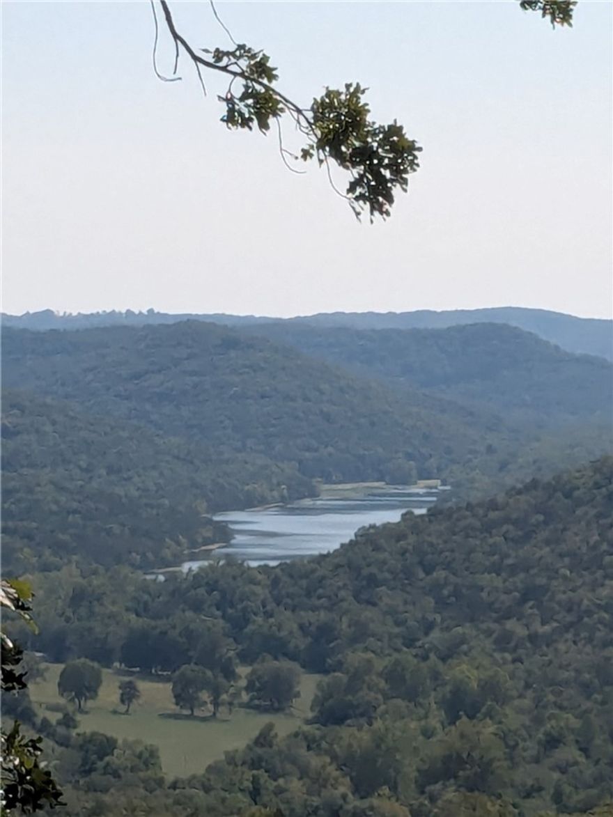 New Price!! This won't last long, so if you're thinking of building your dream home reach out today to plan your tomorrow! Near the main entrance, your new property is walking distance from the Holiday Island Country Club and golf course. Quiet and gently wooded with distant vistas of Lake Leatherwood, this elevated lot offers the best of both worlds. Enjoy the amenities in Holiday Island like golf courses, a country club, swimming, tennis and a marina with a fishing dock or watch the local fauna from your front porch! Nearby Eureka Springs or Rogers offers great shopping and vibrant cultural hubs.