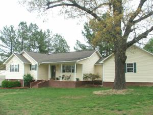 Check out this beautiful 3BR 2BA home on pretty lot in country subdivision. Lots of amenities includes- ceramic tile & wood floors, cathedral ceiling in living room, whirlpool tub, 10x12 shed w/7' lean to, 14x26 metal carport w/electric, garden & deck. Convenient location minutes from town.