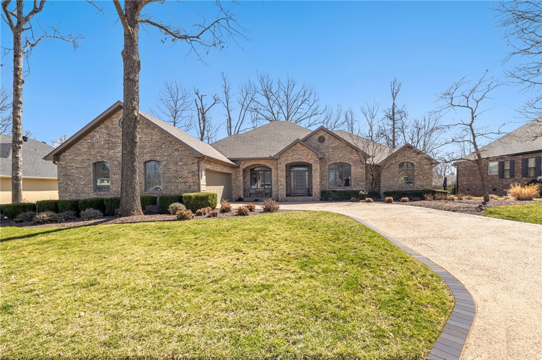 Nestled in a quiet neighborhood in the sought-after Stonehenge Subdivision, this spacious single-story home offers the perfect blend of comfort, character, and convenience. With quick access to Slaughter Pen, Razorback Greenway, Bark Park and I-49, it’s a dream location for outdoor enthusiasts and commuters alike. From the moment you arrive, the spacious front porch and semi-circle driveway create optimum curb appeal and a welcoming first impression. Step inside to discover a sunken den with a cozy fireplace, bringing a warm mid-century feel to the heart of the home. The eat-in kitchen is perfect for casual dining, while multiple flexible spaces allow for a library, home office, or formal dining room—customize the layout to suit your needs!
Enjoy outdoor living at its finest with both a screened-in porch for quiet mornings and a back deck ideal for entertaining family and friends. This home is a rare find in a prime location—don’t miss your chance to make it yours!