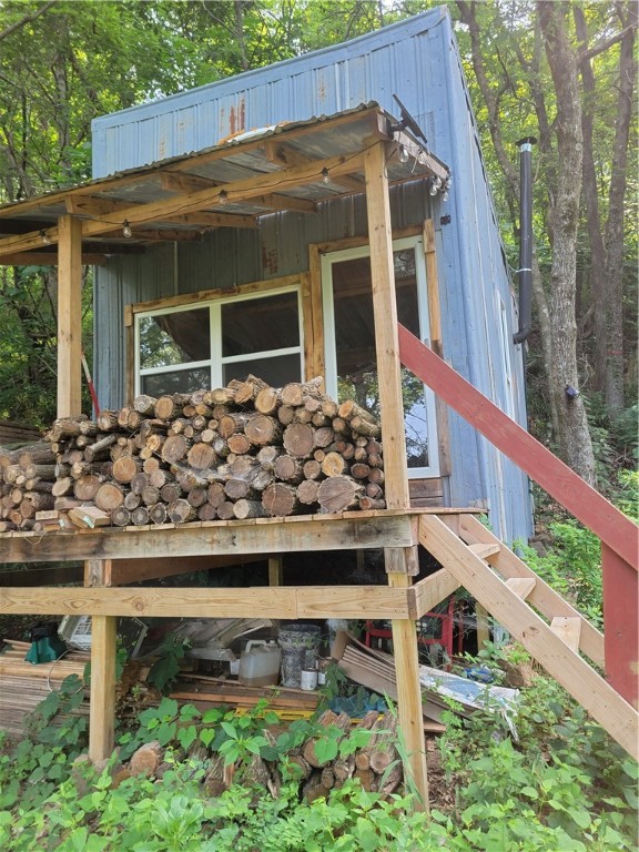 Looking for an OFF GRID weekend/hunting getaway? Have a SxS? THIS property is perfect! 45 acres of woods filled with deer, bear, and so much more. SxS trails have been cut in throughout. The cabin is just a cabin with a wood stove, solar panels and a natural spring. Adorable front porch overlooking the beautiful view with a nice porch swing. Upon purchase buyer gains legal access to a separate 22 acres along the White River for camping, fishing, kayaking, etc. SOLD AS IS.