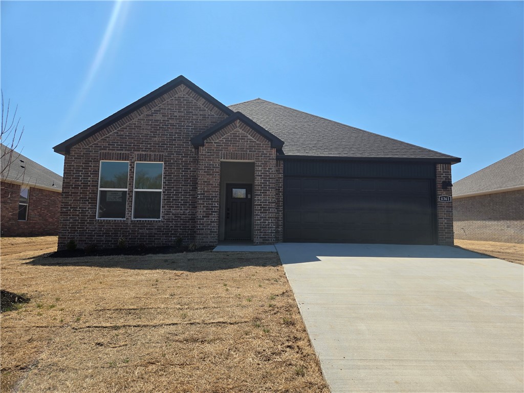 Beautiful Justin Plan in Brentwood Village, located in Springdale, close to the C.L. "Charlie and Willie George Park that consists of walking trails, dog park, splash pad, ball fields, and tennis courts close to the Don Tyson Parkway, near the highly sought-after Don Tyson School of Innovation and other schools. These brand-new homes will be 4-sided Brick! Living room will showcase a beautiful and modern Electric Fireplace with Poplar Mantle. Home will have LVP and Carpet. Kitchen will have 42-inch cabinets, lovely appliances and quartz countertops and tile backsplash. Ceiling fans in Bedroom one and the living room. Primary bedroom has a fabulous en suite with an oversized walk-in shower and elongated commode. LED lighting throughout. High efficiency AC with programmable thermostat. Come find your dream home today! Taxes and Parcel TBD.