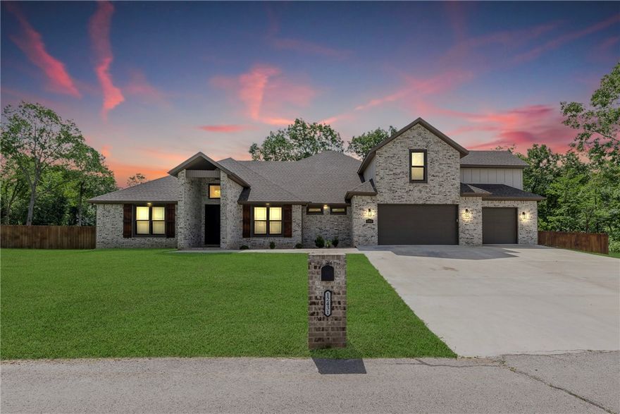 Welcome to your forever home! Situated on 1 acre of flat land in Rogers with mature trees, this home has 4 beds, 3.5 baths, a dedicated office, and a 700+ sq. ft. bonus room. A modern floor plan connecting the kitchen, laundry, primary closet, bath, & bed with quartz countertops. The kitchen boasts amenities such as a butler's pantry, a huge kitchen island, a pot filler, a bottler washer, a custom backsplash, a double oven with an induction cooktop, custom cabinetry, & KitchenAid appliances. The living room features coffered ceilings, a linear gas fireplace, windows with a view of the large backyard, & access to the 600+ sf covered back patio with multiple fans for heat, & a gas fireplace for cooler days. The fenced-in backyard boasts a stained cedar fence. The 1058 sq ft oversized 3-car garage has insulated walls & doors. Lastly, fiber optic high-speed internet is on-site, located only 23 minutes from the home office and 21 minutes from Rogers shopping; this location blends serenity and​​‌​​​​‌​‌​​​‌‌​​​‌‌‌​​‌​​‌‌​​​​ convenience.