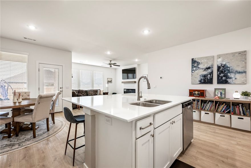 This is a fantastic opportunity to own a newer home with great value as it is the lowest priced home in the neighborhood.  Seller offering $2,000  toward closing cost.  This 4 bedroom 2 bathroom home was built just 2 years ago. This one-level home offers a split floor plan- perfect for comfortable living.  Other features include luxury vinyl plank flooring throughout, quartz countertops, a kitchen with a large island and pantry.  The kitchen is open to the living room.  Living room features an electric fireplace. Bathrooms also feature quartz counter tops and double sinks.  The primary bath has a beautiful tiled shower.  Other features include a tankless hot water tank, and a large separate laundry room.  Located in Pea Ridge which still has the small town feel, but is just minutes from Bentonville, Rogers, the Wal-Mart home office and more.