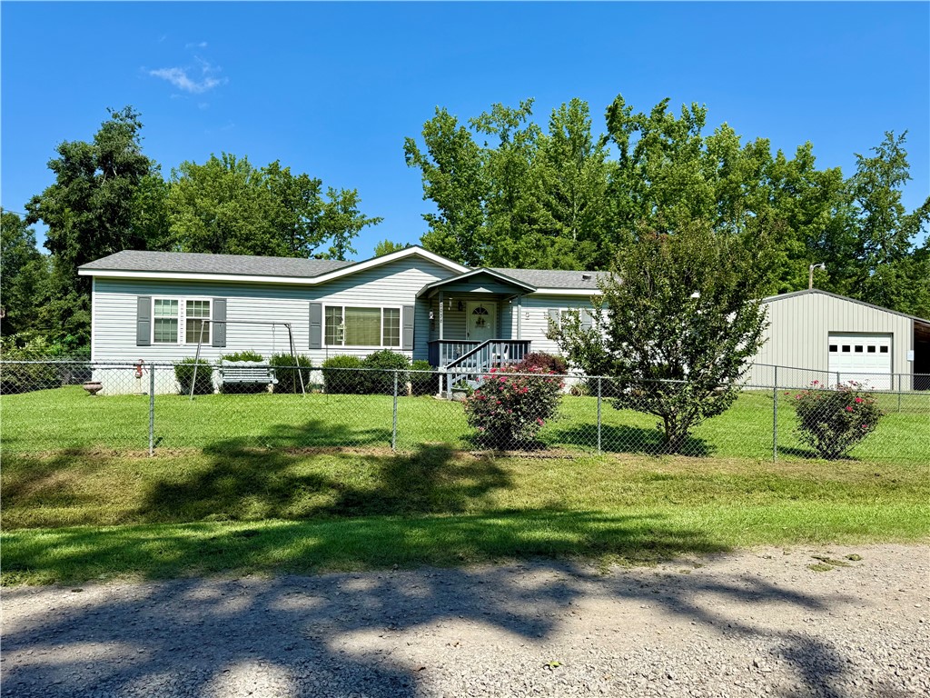Enjoy the outdoors and peaceful living in this well-maintained 3-bedroom, 2-bath modular home sitting on 0.4 acres in the desirable Carter Cove area. Just minutes from Lake Nimrod, this property offers the perfect mix of comfort, convenience, and recreational access!
Step inside to find new carpet, a new refrigerator, and a roof less than 4 years old, making this home move-in ready. The front yard is fenced, ideal for pets or kids, and the large shop is a true bonus – featuring central heat and air, a half bath, and plenty of space for projects, storage, or even a home-based business.
Located just a short drive from Lake Nimrod, you'll enjoy some of the best fishing in the region—crappie, bass, catfish, and more. The surrounding area also offers outstanding deer, duck, and turkey hunting, along with public land access and camping opportunities. Whether you’re looking for a weekend retreat or a full-time residence, Carter Cove is the place for lake lovers and outdoor enthusiasts.