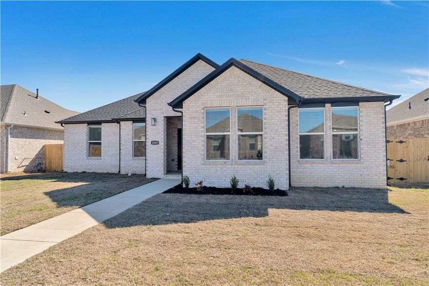 Absolutely stunning home in the heart of Fayetteville!  4bed 2bath all brick home features an open kitchen with quartz countertops and backsplash. Luxury LVP throughout & carpet in the 3 guest rooms. Master bed features a perfect en-suite with oversized walk-in shower. Amazing floor plan with lots of storage! This home is perfectly located in Fayetteville, AR - Close to the U of A Campus, Owl Creek, John L. Colbert Middle School, and I-49. Just minutes away from trails, eateries, schools, parks and lots more. 2 car garage, fridge, w/d provided for your convenience. Don't miss out on making this exceptional property your new home! Available 6/1/26!
