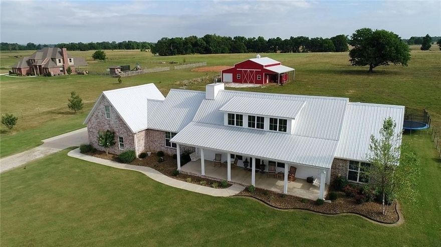 Amazing location and this property has it all!! Custom farm house in coveted west Bentonville area! Every detail was carefully planned on this approximate 4.6 acres from the beautiful home, shop/barn with power and concrete floors, saltwater pool and pool/guest house...and its got solar as well!! The house features a gourmet kitchen complete with full refrigerator/freezer and is open concept floorplan that is great for entertaining!! Details were not overlooked on the interior of the home from the shiplap to beautiful hardwood flooring to the high efficiency wood burning fireplace!! Outside you have an oasis for your family and friends! Large covered patio, beautiful pool, outdoor sound and much more! You have to see this one!! ****Square footage includes house and pool house.