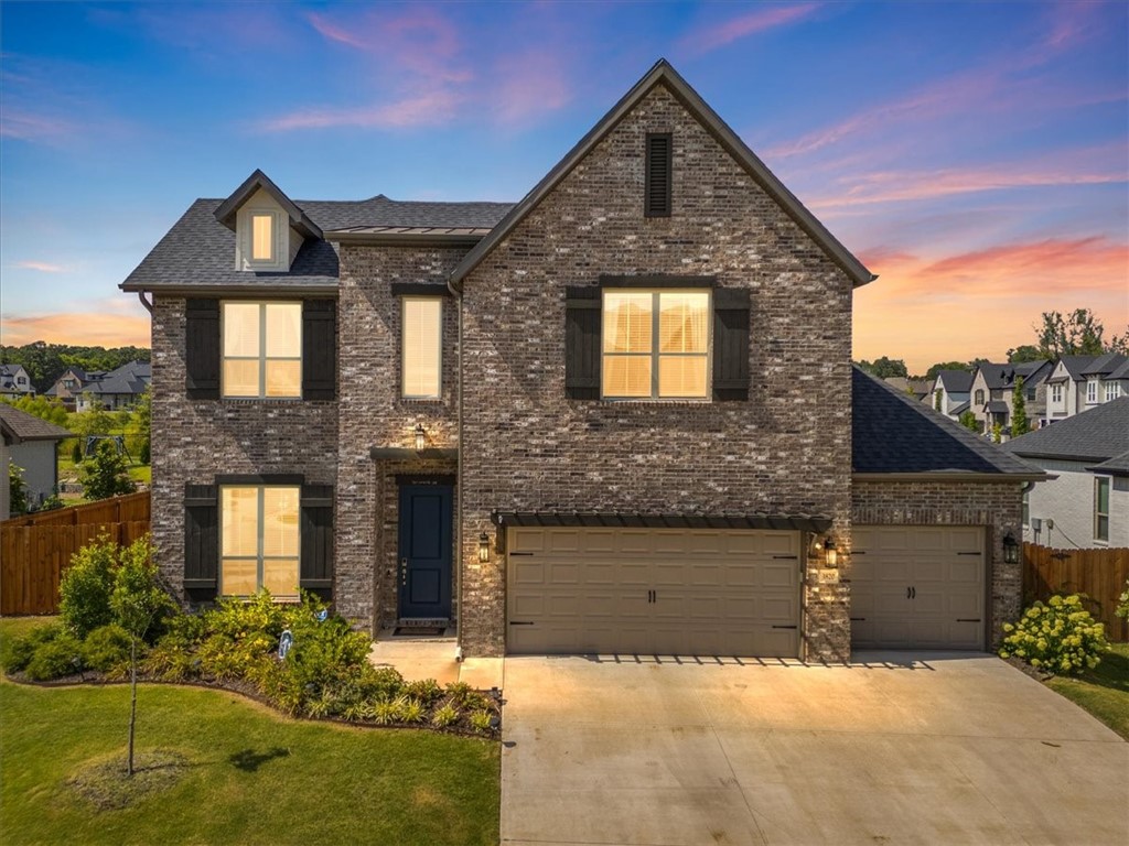 Welcome to this stunning Kensington floor plan by Buffington Homes, located in the highly desirable Magnolia Park neighborhood. This spacious 5-bedroom, 3.5-bath home offers the perfect blend of comfort, style, and thoughtful upgrades. Enjoy a bright and open living area centered around a cozy fireplace, with a seamless flow into the chefās kitchen featuring upgraded ceiling-height cabinets, a large quartz island, and generous pantry space. A convenient drop zone near the garage adds functionality for busy households. The primary suite is located on the main floor and features his-and-hers closets. Upstairs, you'll find 4 additional well-appointed bedrooms and 2 full baths. Step outside to a beautifully extended custom patio, surrounded by professionally designed landscapingāperfect for entertaining or relaxing evenings at home. This home offers the quality of new construction in West Fayetteville with proximity to I49, UofA, shopping and the highly anticipated Mt Comfort square.