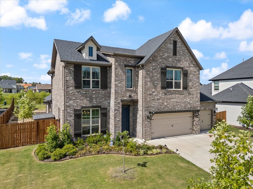 Welcome to this stunning Kensington floor plan by Buffington Homes, located in the highly desirable Magnolia Park neighborhood. This spacious 5-bedroom, 3.5-bath home offers the perfect blend of comfort, style, and thoughtful upgrades. Enjoy a bright and open living area centered around a cozy fireplace, with a seamless flow into the chefās kitchen featuring upgraded ceiling-height cabinets, a large quartz island, and generous pantry space. A convenient drop zone near the garage adds functionality for busy households. The primary suite is located on the main floor and features his-and-hers closets. Upstairs, you'll find 4 additional well-appointed bedrooms and 2 full baths. Step outside to a beautifully extended custom patio, surrounded by professionally designed landscapingāperfect for entertaining or relaxing evenings at home. This home offers the quality of new construction in West Fayetteville with proximity to I49, UofA, shopping and the highly anticipated Mt Comfort square.