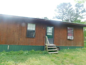 Repair and reap the benefits of this Ponderosa with acreage, pond, 3 bedrooms, 2 bath, workshop, fenced and seclusion. PROPERTY IS SOLD AS IS WHERE IS