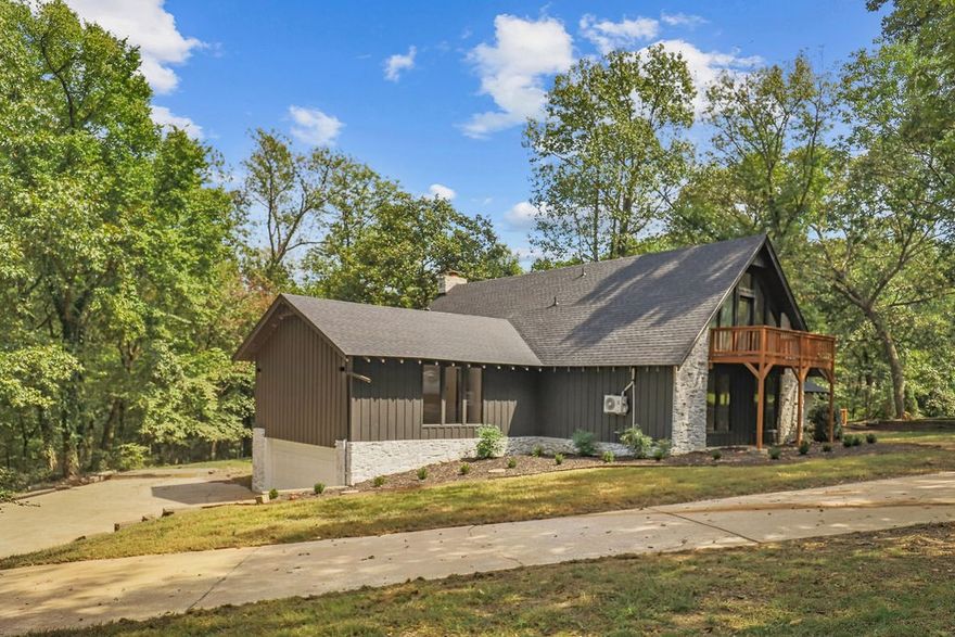 Situated on a premium lot with exceptional privacy, 101 North Dogwood offers a beautifully renovated home perfect for entertaining. Recent updates include new wood floors, quartz countertops, modern appliances, updated hardware, plumbing, and lighting packages. The thoughtful layout features a custom pantry with outlets and shelving, formal and informal dining areas, living room, and den. The main level includes two bedrooms sharing a Jack and Jill bathroom, while upstairs offers a fourth bedroom with closet, private balcony, and full bath. The secluded primary bedroom is exceptionally spacious with windows on multiple sides and a huge walk-in closet. Additional highlights include ceiling fans throughout, generous laundry room, and a brand new roof. With 3.5 bathrooms total, this home combines modern comfort with flexible living spaces, and all within walking distance of John Brown University and Downtown Siloam Springs.