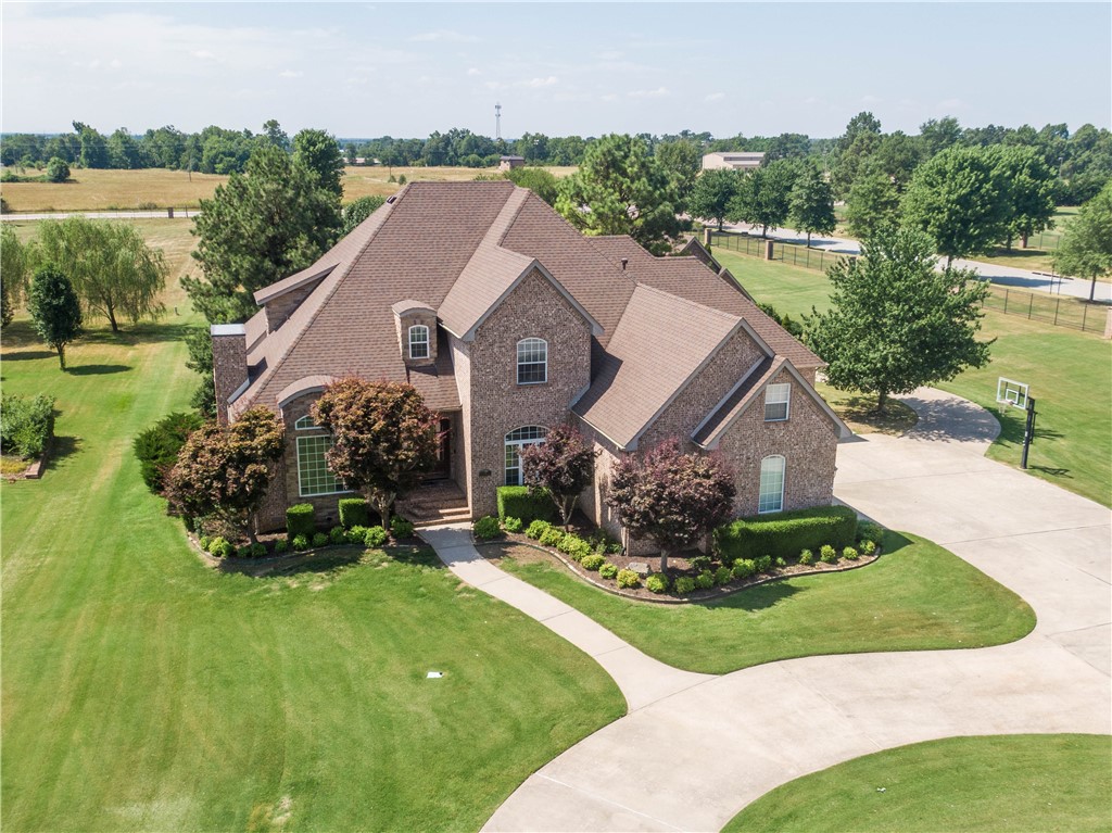 Beautiful executive home in the heart of Bentonville with plenty of room for entertaining the whole family! Located in highly sought-after Stonebriar neighborhood, the spacious home and fully finished, 740 sq/ft guesthouse (not included in square footage total) sit on a manicured 2.28 acre lot, complete with large pool and custom built-in outdoor grill area. The main house is spacious and has a great layout, with two living areas, large kitchen complete with high-end appliances, executive office, and primary suite on the main level and another 4 bedrooms, 2 full baths, and bonus room upstairs. The guesthouse has its own kitchen, living room, and full bath on the main level, with a bedroom upstairs. The home has had many recent upgrades including 2 brand new HVACS and all new decks, roof and gutters in 2020, and 2 large capacity hot water heaters replaced in 2018.