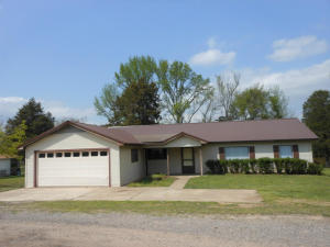 Country living yet close to town. Lots of room to relax. Large living room, kitchen cabinets galore, dining room, breakfast bar, laundry room, sun room or extra bedroom. Double garage, detached workshop with concrete floor, back deck and patio. Located on a dead end street.
