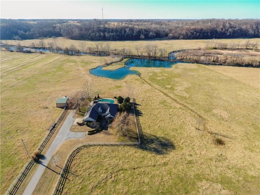Prime Development Property in Cave Springs located with Hwy 112 Frontage.    Property features a Home and18 acres located in the heart of the fastest growing area in Northwest Arkansas! Bentonville Schools! This property includes Osage Creek frontage, flat pasture, 2 fresh-water lakes, pool, barn/shop. Future highway widening makes this property extremely desirable for future development with sewer available.   Adjoining 42 acres is also available for purchase MLX 128947.