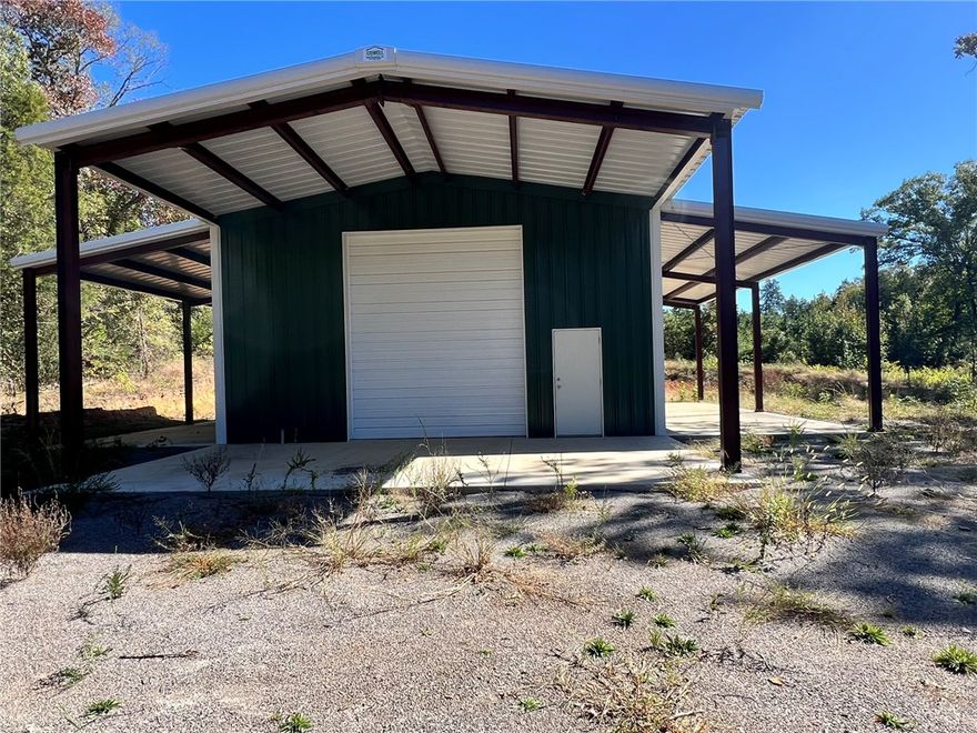 RARE 41.56± acre tract just north of Atkins with gated entry and a 30'×40' insulated barn already on site — an ideal head start for a barndominium build or a turn-key RV/Shop setup. The barn is insulated and has plumbing roughed in for a bathroom and kitchen. Two 14' double doors with LiftMaster openers make it easy to bring in a travel home, equipment, or toys. Exterior wings add two 14'×40' covered concrete bays plus a 15'×30' covered porch for outdoor use or future expansion. Land is planted in row pine with thinning projected in 2026 and an anticipated harvest around 2033 (buyer to verify). A rural setting offering privacy and improvements already underway. Schedule a tour and explore how this site can work for you.