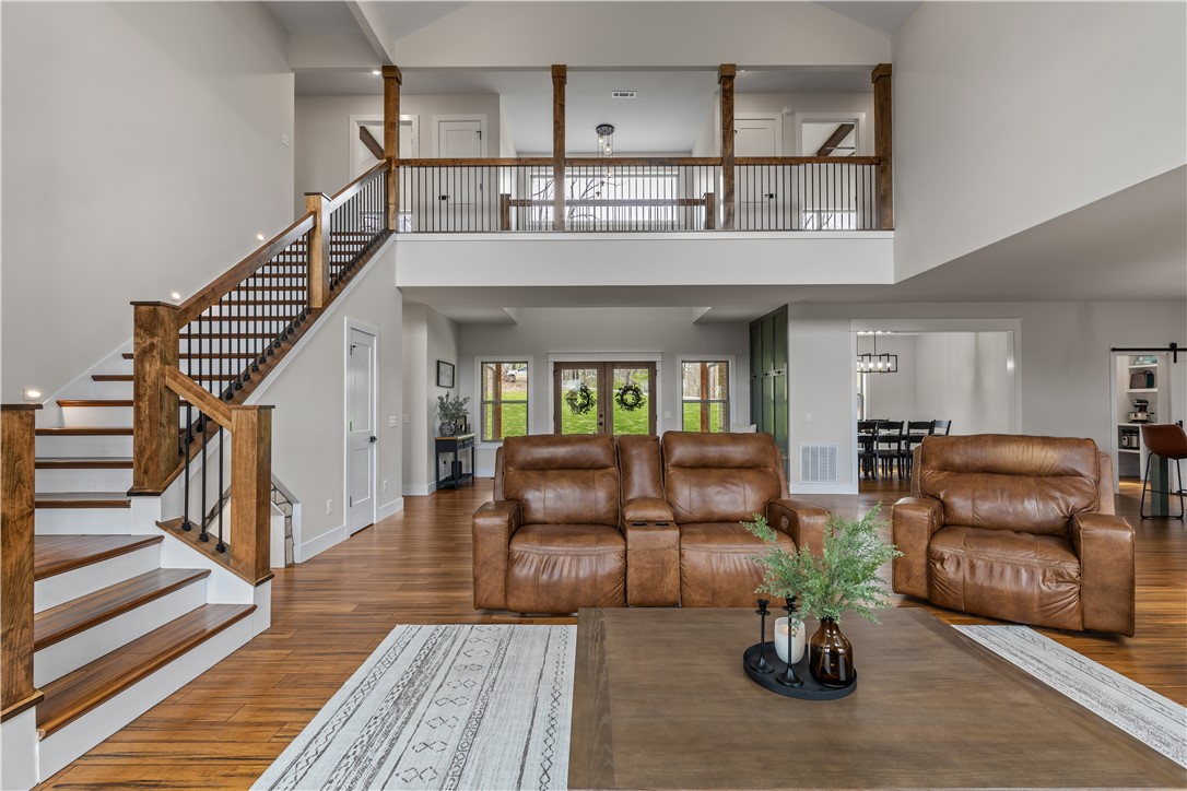 Tucked at the end of a quiet cul-de-sac, this stunning home offers privacy, space, & comfort on nearly 2 AC. Just 20 mins from the new Walmart Home Office & 7 mins to I-49. With 4,204 sq ft, the main level features a spacious suite, dedicated home office, & an inviting open-concept living area that seamlessly connects the kitchen, living room, & a partially open formal dining area. A cozy fireplace adds warmth & ambiance, making this the perfect space for gatherings/quiet evenings & the stylish 1/2 bath is perfect for guests. Upstairs, youāll find 6 versatile rooms + two full bathrooms. Whether you need bedrooms, a home gym, creative studio, or guest quarters, thereās ample space to customize the home to fit your lifestyle. Extras include:3-car garage with one extra-tall bay ready for a car lift, hot tub that stays. Surrounded by trees & open yard space, this home offers ideal outdoor living. With a flexible floor plan, peaceful setting, and quick access to town, this home truly checks all the boxes