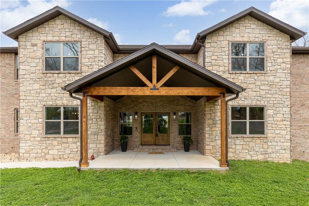 Tucked at the end of a quiet cul-de-sac, this stunning home offers privacy, space, & comfort on nearly 2 AC. Just 20 mins from the new Walmart Home Office & 7 mins to I-49. With 4,204 sq ft, the main level features a spacious suite, dedicated home office, & an inviting open-concept living area that seamlessly connects the kitchen, living room, & a partially open formal dining area. A cozy fireplace adds warmth & ambiance, making this the perfect space for gatherings/quiet evenings & the stylish 1/2 bath is perfect for guests. Upstairs, you’ll find 6 versatile rooms + two full bathrooms. Whether you need bedrooms, a home gym, creative studio, or guest quarters, there’s ample space to customize the home to fit your lifestyle. Extras include:3-car garage with one extra-tall bay ready for a car lift, hot tub that stays. Surrounded by trees & open yard space, this home offers ideal outdoor living. With a flexible floor plan, peaceful setting, and quick access to town, this home truly checks all the boxes