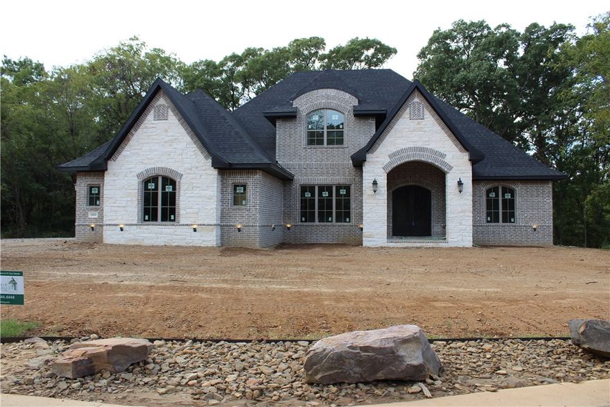 NEW CONSTRUCTION IN COPPER RIDGE BY CAPSTONE DESIGN BUILD! BENTONVILLE SCHOOLS!  Features include a level 1.08 acre wooded lot, 5BD/4.5BA, (4 bedrooms on main level), bonus room, media room, study, formal dining room, mud area, butler's pantry, coffered ceilings, several built-ins, hidden bookcase door in living room, fireplace in master bedroom, and an oversized covered patio with fireplace/grill. Conveniently located near I-49 & future 8th St off ramp!