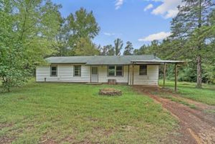 If you are willing to do a little work this house may be for you.  If has 3 bedrooms, 2 baths, new heat and air, two living area all on 1.5 acres.  It is out in the country yet ten minutes from downtown Russellville