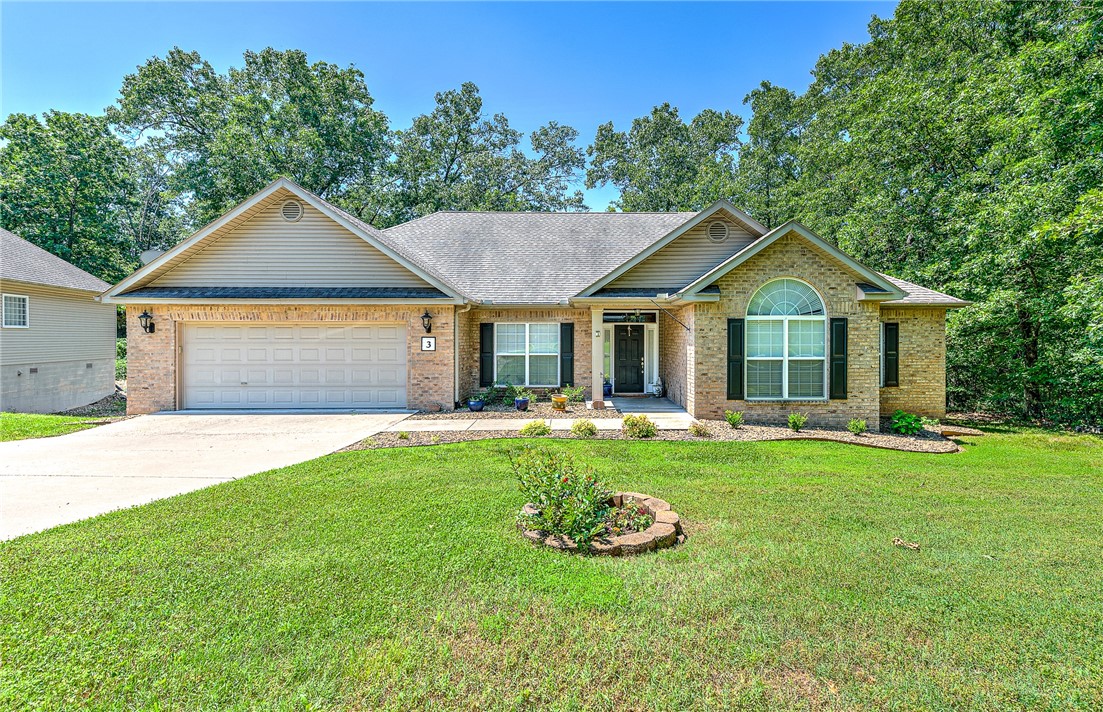 Come enjoy this beautiful home featuring an open floor plan with abundant natural lighting. The thoughtfully designed split floor plan offers both privacy and functionality. You'll be captivated by the charm of the brick and wood floors, complemented by fresh new paint on cabinets and walls, new hardware and elegant granite countertops. The kitchen boasts a top-of-the-line gas stove and exquisite crown molding, making it a chef's delight. Step outside to your oversized newly stained deck, perfect for indoor/outdoor living, surrounded by numerous windows and doors that seamlessly blend the interior with the exterior. The spacious bedrooms provide ample comfort. Located just minutes from Bentonville, this home offers the perfect blend of convenience and tranquility. The home has had a deep clean and is move in ready. Kitchen refrigerator, washer and dryer to convey ( brand new 2 years ago.) All roof repairs and proactive measures have been done to the roof to put it in tip top shape.