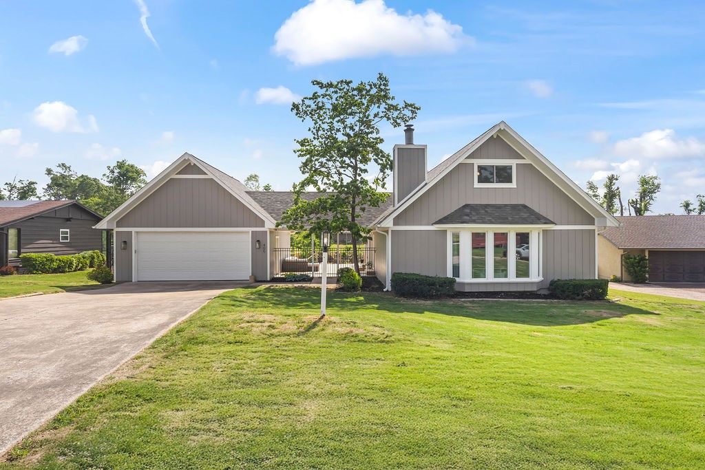 Imagine just walking down the street to the greenway! Private, one loop neighborhood in the middle of town. 2-3 minute drive to Pinnacle area, Promenade, I-49, AMP, movie theatre and more! This home sits on a half an acre allowing plenty of space for outside activities! See attachments for updates, which include new deck, roof, gutters, garage door, windows, water heater, interior/exterior paint, flooring, bathroom and more! Don't miss out on this gem close to everything, but yet private as well!