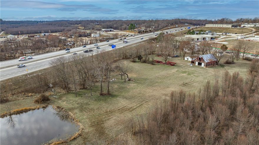 Commercial property with I-49 visibility in Fayetteville. 1.75 acres MOL - subject to lot split approval with access easement from W Van Asche Drive. Capitalize on enormous growth in this area. Zoned R-A currently, however future land use suggest Urban Center. Bordering property all zoned C-2. Taxes are estimated. Call agent for more information.