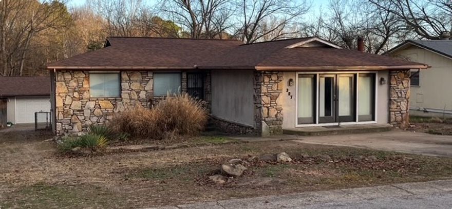 Great home with plenty of room for all the family and their various interests and hobbies!  House boasts 3 bedrooms, 3 baths, 3-4 family areas, hardwood & tile floors, 2 fireplaces, walkout basement, covered patio and screened balcony. There's a covered carport parking area for one vehicle, and 2-car garage with workshop area for all your DIY projects.  There is mature landscaping, a garden area for your green-thumb, and 2 sheds (3x7 & 10x16) for all your gardening tools and yard toys.  The 20x16 Building, with electricity, is a blank slate for whatever your needs require. Be it, storage for Holiday decorations, an art or photography studio, Workout or yoga location, or a fabulous She-shed/Man-cave!