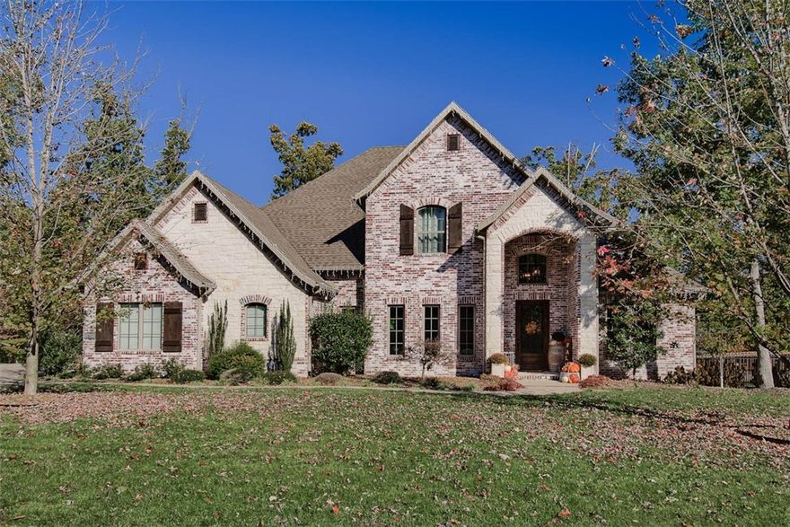 Exquisite Home in prestigious Versailles subdivision, sitting on over an acre lot with in-ground salt water pool w/waterfall.  All this & only 4 miles to downtown Bentonville & Walmart HQ. This home has great curb appeal & a fantastic floor plan with an abundance of natural lighting. Large living room has fireplace, wood beams & brick accents w/surround sound & opens to the custom kitchen w/stainless appliances, granite, 36" gas cook top, microwave drawer, mini beverage fridge, pantry & butler's pantry. Home has formal dining room & separate office just off the entry.  Primary suite has great views of the backyard & lots of windows. Primary bath has 2 vanities w/extra counter space, jetted tub, walk-in shower, large walk in closet that connects to the laundry room. Upstairs you have 3 more bedrooms, 2 full baths & media room with projector, 120 inch screen & a wet bar.  Home has a 3 car Side Entry Garages w/Extended Driveway, covered deck area overlooking pool w/lush landscaping & pergola.Great private wooded view.