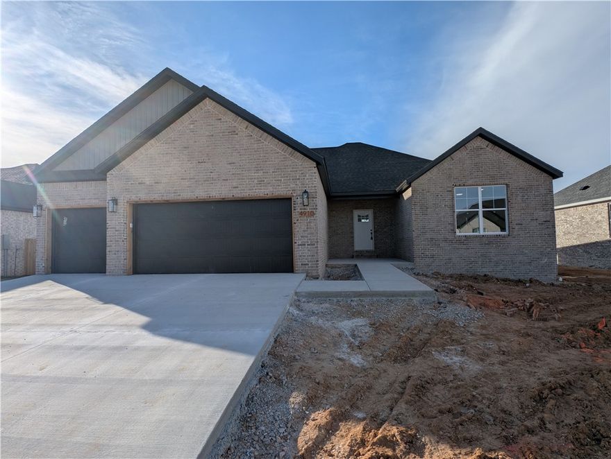 Step into refined modern living with this stunning new-construction home, where craftsmanship & comfort meet in every detail. Walk into experience the vaulted living with its sleek black gas log fireplace. Next you will find the gourmet kitchen a true showpiece—bright & functional with an expansive island draped in stunning stone, complemented by elegant lantern-style pendant lighting, pristine white cabinetry, & brand-new stainless appliances. The owner’s suite carries the same luxurious feel, featuring a breathtaking wood-accent tray ceiling, recessed lighting, and sun-filled windows that make the room feel warm and inviting. Outside, the home’s handsome brick exterior, bold black accents, and generous front porch create instant curb appeal, while the freshly poured driveway leads to a spacious 3 car garage ideal for storage and convenience. With thoughtful design & high-end finishes throughout, this home offers the perfect blend of style, durability, & everyday livability—ready to welcome its very first owners.