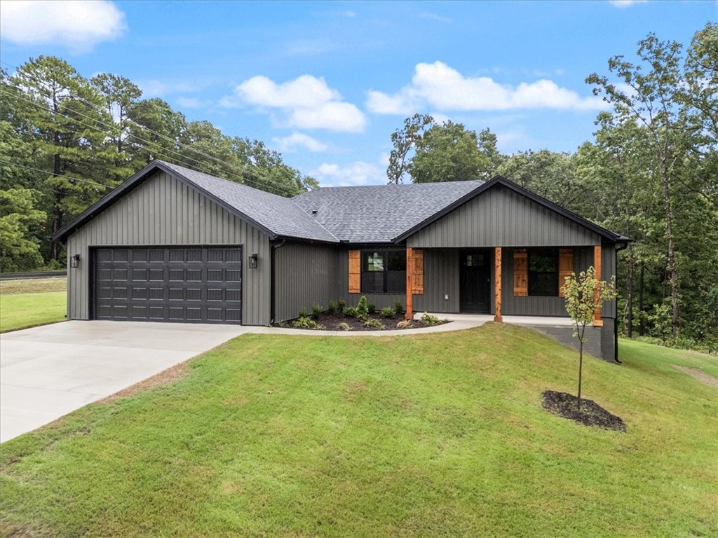 Looking for your sparkling new home and love the trails? Bike out from this location at 1 Colne Lane! Love to fish? You'll be 1.3 miles to the Lake Ann boat ramp. Golf, swim or fitness? Seven minutes to the Metfield Recreation Area! Just completed new construction with great curb appeal. Great color choice with cedar accents. Open floor plan with your gas log fireplace separating your living area from your kitchen and dining space. Designer level kitchen with quartz counters, a large island and generously sized pantry. Primary suite with a walk in closet that is awe inspiring. Primary bath with double vanity, quartz counters and fully tiled shower. Two additional bedrooms and hall bath. Covered back porch perfect for enjoying your morning coffee. Driveway and yard are LEVEL. You won't see that every day in Bella Vista! Beautiful home in a fabulous location! Irrigation system for front yard and flower beds! Have the greenest grass in town!