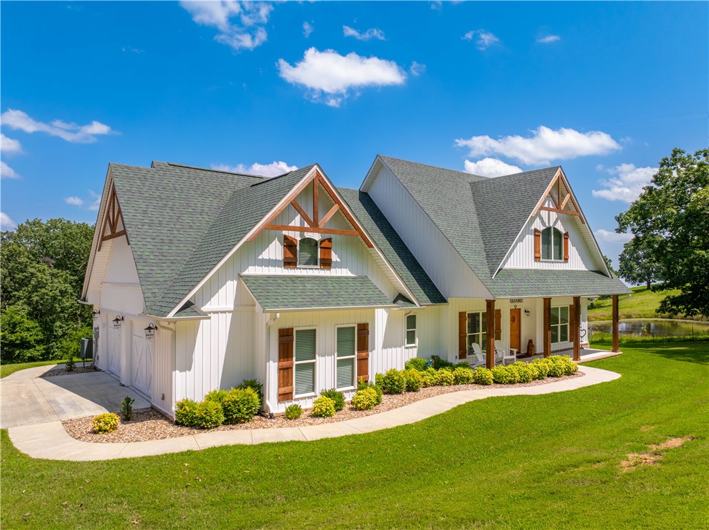Welcome to your private retreatāa stunning one-level modern farmhouse on 6 acres, featuring a spring-fed pond and breathtaking views. Located just 35 minutes from Fayetteville and 25 minutes from Ft Smith, this tranquil property offers the perfect blend of nature and luxury. Enjoy ultimate privacy with no neighboring homes in sight. Inside this 3bd/2ba home, features an open floorplan with a split bedroom layout and custom built-ins for all your storage needs. The family room boasts a cathedral ceiling with a wall of windows and remote-control fireplace. The chefās kitchen features granite countertops, Frigidaire Gallery appliances, & large walk-in pantry. Enjoy outdoor living on the large back porch, and take advantage of the oversized 26x36 insulated garage and a 30x40 workshop for hobbies or storage. The professionally landscaped property includes mature trees for shade and great fall color.
This custom home blends country living, modern comfort, & privacy.
Donāt miss your opportunity to own this hidden gem!