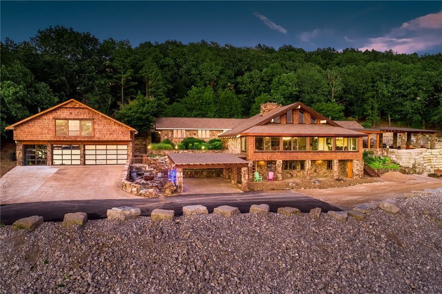 This extensively remodeled home will stand the test of time for decades to come. Hickory floors, floor to ceiling fireplaces, and windows that frame the big lake view. Gourmet kitchen offers great space to mingle before retreating to the spacious dining/living room. Main house has 4 BR and 31/2 baths. Property includes a guest house complete with 2 BR and ! bath. And don't forget the 5 slip private boat dock to enhance the lake experience.