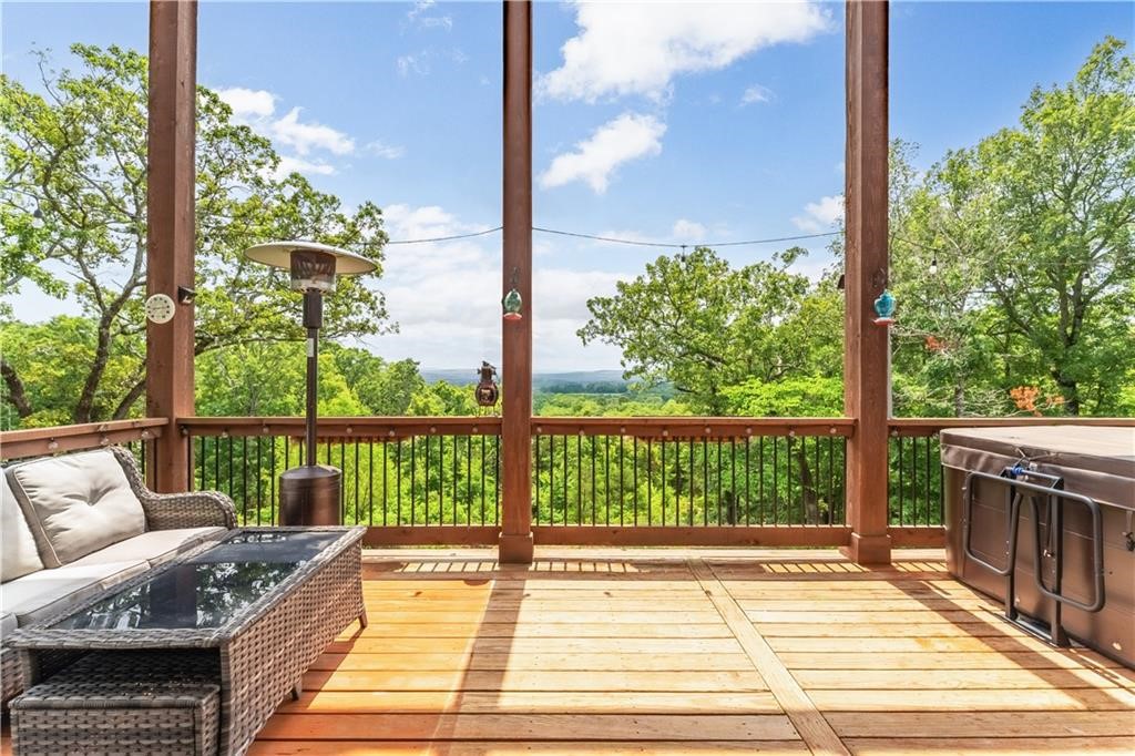 Stunning custom-built home on 10 acres with breathtaking valley views! Just 13 minutes to Mission/Crossover, 7 miles to Elkins & minutes to Goshen. This Craftsman-style residence features a brick & concrete siding exterior & charming covered front porch. Enjoy sunsets from the expansive wrap-around deck overlooking rolling hills. The kitchen offers leathered granite countertops, large pantry, stainless steel appliances, eat-in area & spacious island w/storage. The dining room is perfect for entertaining & seamlessly connects to the living room, which has a gas fireplace, deck access & 2-story ceiling w/ abundant natural light. Primary bedroom provides stunning valley views through French doors leading to a Juliet balcony. The luxurious suite also has a walk-in closet, spacious bathroom w/ dual vanities, a soaking tub & large tile shower. Additional bedrooms, full bath & second living room are located upstairs. Extra storage is available under the house. Also listed w/5 acres under MLS#1281810 & 38 acres MLS#1296920