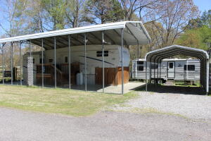A Fisherman's Dream! -- TWO furnished campers on (2) lots within walking distance to Lucky Landing Boat Ramp on beautiful Lake Atkins!Property has been well maintained and includes two carports, a storage building with a generator, & a wooden deck with storage space. Lake Atkins is well known for largemouth bass, crappie, and catfish...and it's approaching spring time! Bring your fishing poles and your family!Agents - SEE PRIVATE REMARKS
