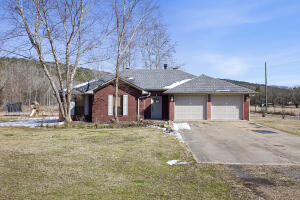 Country living at its finest. This spacious 3 bedroom, 2 bath home has a split floor plan, fireplace in the living room, and beautiful hardwood floors. Relax in your spacious master suite with a sitting area, or enjoy your morning coffee in the sunroom overlooking your private pond. With 15 acres +/- this home would be perfect for your very own hobby farm. Call us for your showing today!