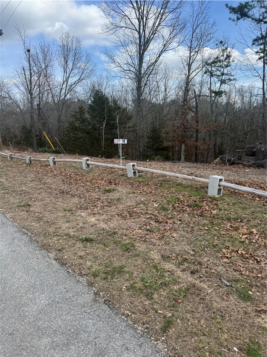 Beautiful building lot located near Rock Branch Marina for residence or vacation home. Enjoy nature and availability Beaver Lake access. Property has 105 feet of road frontage, cleared frontage with sloped wooded area that will provide for a walkout basement.
Survey of lot attached along with perc test.