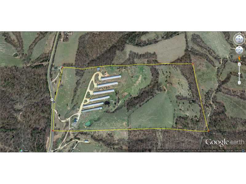 Large poultry farm with great income. This property is almost all pasture and it has three wells, a 40x60 stacking shed, pipe corral and 3 ponds. the chicken houses are in very good condition, completey retroed 2012. They raise 8 week boilers,for tysons under premium contract. The dwelling house has a large deck overlooking a 17'x35' inground pool. They also have a generator that runs all 6 chicken houses and two wells. The property fronts Highway 21 south.