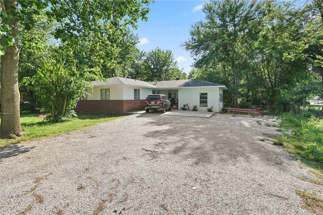 Great Development Potential in Downtown Rogers!!! The property is ideal for multifamily or townhomes. 4 parcels adding to 1.1 acres. Water and sewer easily accessible. House is rented for $950 per month. Property sold as is. Please do not disturb tenants.