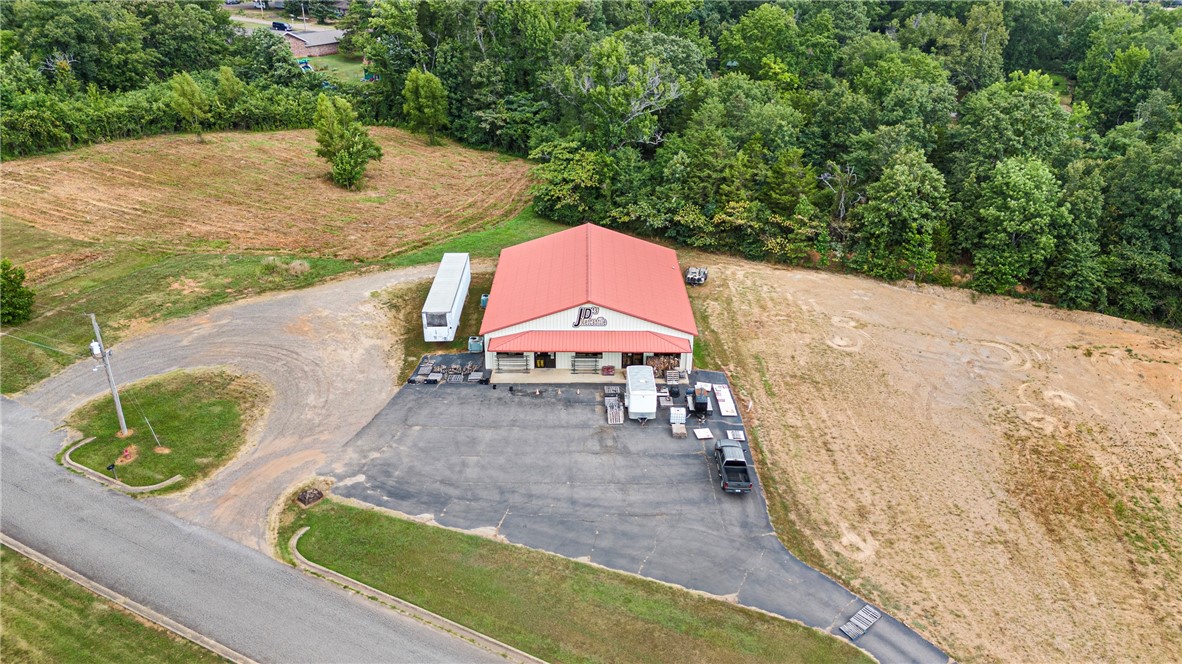 Outstanding commercial opportunity located just off I-40 Exit 94 in the heart of Atkins, Arkansas! This 4,200+ sq ft building has served the community as a hardware store for over 18 years and recently added a popular deli section. The structure offers spacious retail space, a fully operational deli area, two bathrooms both half baths, and ample storageāall situated on 3.74 acres of land with high visibility from the interstate. The property is ideally positioned behind Sonic Drive-In, near McDonald's, Dollar General, and Jordanās, benefiting from consistent area traffic and customer flow. I-40 boasts an Average Annual Daily Traffic (AADT) of approximately 8,800 vehicles, providing excellent exposure for any business use. Zoned for commercial use, the land provides plenty of room for parking, expansion, or subdivision. Seller is open to dividing the property to suit buyer needs. Inventory and equipment are available to purchase for an additional price, making this a potential turnkey investment.