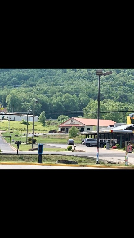 Outstanding commercial opportunity located just off I-40 Exit 94 in the heart of Atkins, Arkansas! This 4,200+ sq ft building has served the community as a hardware store for over 18 years and recently added a popular deli section. The structure offers spacious retail space, a fully operational deli area, two bathrooms both half baths, and ample storage—all situated on 3.74 acres of land with high visibility from the interstate. The property is ideally positioned behind Sonic Drive-In, near McDonald's, Dollar General, and Jordan’s, benefiting from consistent area traffic and customer flow. I-40 boasts an Average Annual Daily Traffic (AADT) of approximately 8,800 vehicles, providing excellent exposure for any business use. Zoned for commercial use, the land provides plenty of room for parking, expansion, or subdivision. Seller is open to dividing the property to suit buyer needs. Inventory and equipment are available to purchase for an additional price, making this a potential turnkey investment.