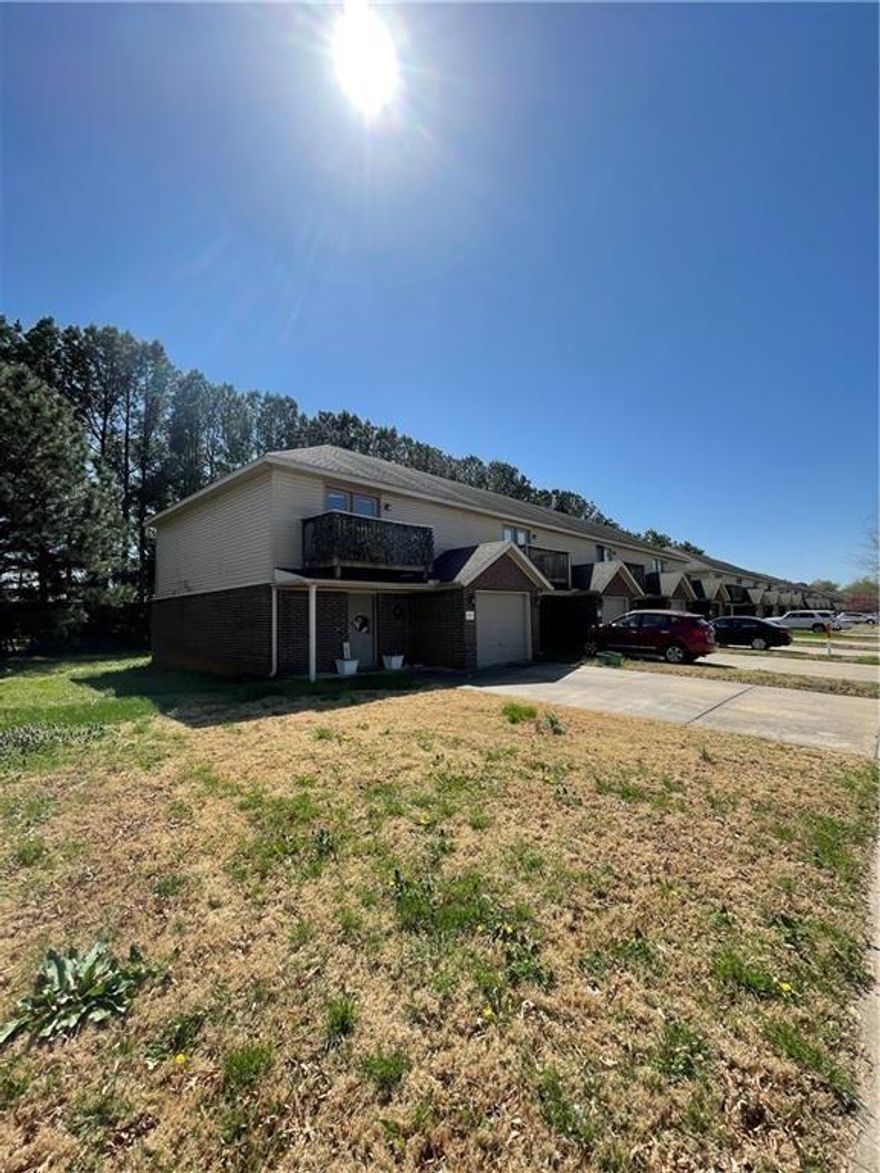 Great townhouse in W Fayetteville. Home features vinyl wood flooring in living room that opens up to a large kitchen with breakfast bar and dining area, fireplace, back patio for entertaining, new carpet in bedrooms and stairs, 2 master bedrooms with their own baths and walk in closets and half bath downstairs. 1 car garage and all appliances.