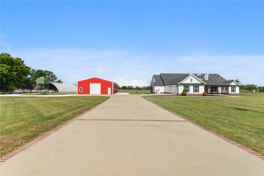 This home was built with all the extras.  Interior boasts beautiful high ceilings with an amazing master bedroom/bathroom.  Three out of the four bedrooms have attached bathrooms. Nine-foot-deep pool with an amazing back porch for entertaining. Built in Generac generator, RV hookups, 40x75 metal building with 14 foot pull through garage doors for perfect RV storage. Both Washer/Dryer sets convey with home. This home truly has to many extras to list, you must see for yourself. Seller to offer an amazing $25,000 in closing costs and landscaping allowance. This home is sitting directly across from the Pea Ridge Military Park with amazing views from the front porch of the Rolling hills.  Don't miss your opportunity at this amazing home.
**Property also listed as home and 5 acres under MLS 1223332.