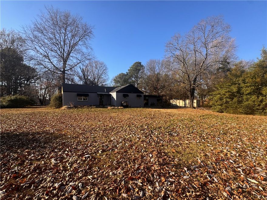 Don’t sleep on Siloam Springs. This is the kind of opportunity investors wait for: a rare 1.02-acre flat lot dotted with beautiful mature trees, in a convenient location close to downtown, schools, shopping, and daily essentials. The existing 1944 ranch is an AS-IS project with historic charm and tons of potential. Siloam Springs continues to build momentum with community growth and new development activity (see the city’s major projects tracker), making this a smart spot to invest your time and budget. Cash or renovation loan only. Bring your vision, your crew, and make the most of an exceptional homesite.