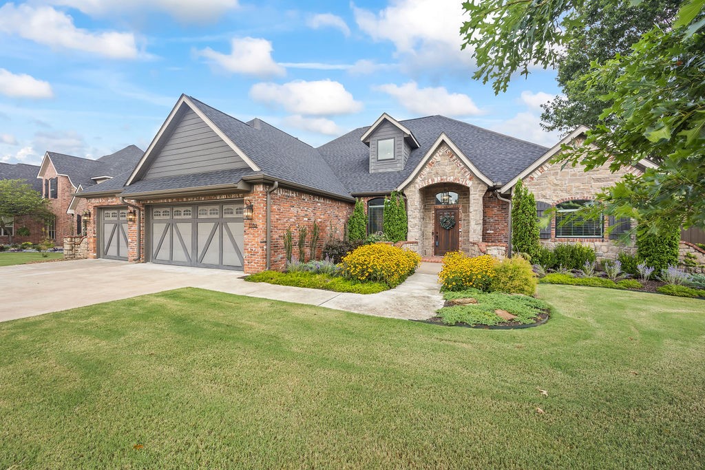 Discover the pinnacle of luxury living in Bentonville's sought-after Lochmoor Subdivision! This stunning home sits on a pristine corner lot in a private cul-de-sac, featuring 4 beds and 4 baths. Every inch has been meticulously renovated for comfort, convenience, and style. Step into a bright, spacious layout filled with natural light that creates a serene atmosphere. Enjoy privacy with all bedrooms on the main floor, including an expansive primary suite with patio access and a spa-like ensuite. Upstairs, a bonus room with a full bath adds versatility. The chef's kitchen features premium appliances, granite countertops, and a gas cooktop, while the backyard oasis offers raised garden beds and fruit trees. Over $200K in upgrades enhance this home, complemented by Lochmoor Club amenities—pool, tennis, and more. Close to schools, parks, and Bentonville Community Center, this residence defines modern elegance and convenience. Welcome home!