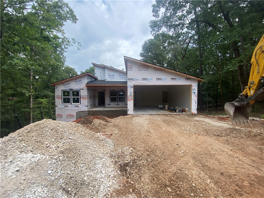 Stunning new construction in Bella Vista, AR! This modern 3 bed, 2 bath home features an open layout, dedicated office/study/library, and stylish accent walls in the primary bedroom and office. Enjoy walk-in closets, built-in cabinets, a large laundry room, plenty of storage and a spacious front deck perfect for relaxing or entertaining. Sleek finishes, thoughtful design, and a peaceful setting make this home a must-see!