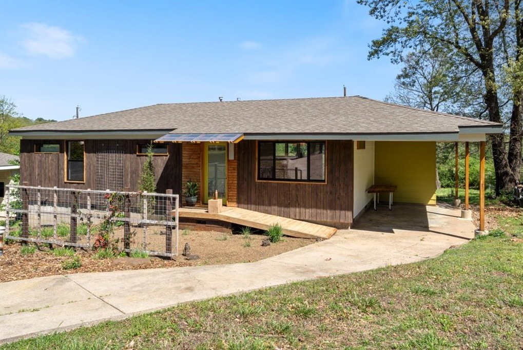 Freshly renovated home convenient to the I-49 between the University of Arkansas and Kessler Park within walking distance of the Razorback Greenway. This beautiful two bedroom, two bath home is bathed in sunlight from new windows. Gorgeous bamboo floors combine with locally harvested white oak and red cedar features to create a warm, inviting interior. Enjoy watching the new native plant garden take root from the new cedar deck and front patio. Home has all new plumbing, electrical panel, and drain lines, new insulation, HVAC, HWH, and appliances, and a new dehumidifier in the crawl space. Spacious lot is large enought to allow for the construction of a second home in the rear. Under existing zoning, the second structure could be an accessory or primary dwelling unit.