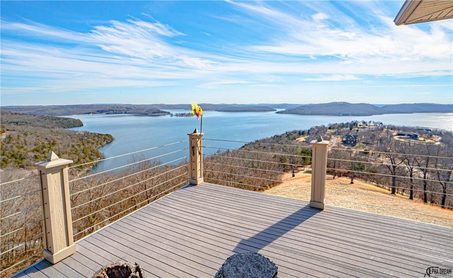 2 boat slips in community dock plus Incredible Beaver Lake views will captivate you upon entering this beautiful home.  Enjoy entertaining guests or simply relaxing on the expansive covered upper and lower decks.  A large open kitchen, dining room, living areas and sunroom are on the main level of the home including two bedrooms with large closets and 3 bathrooms.  The lower level offers grand lake views, open living area with partial kitchen and dining area.  In addition the lower level includes hot tub room overlooking the lake, safe room, laundry room and master bedroom.  Caution, no barrier on the lower deck.